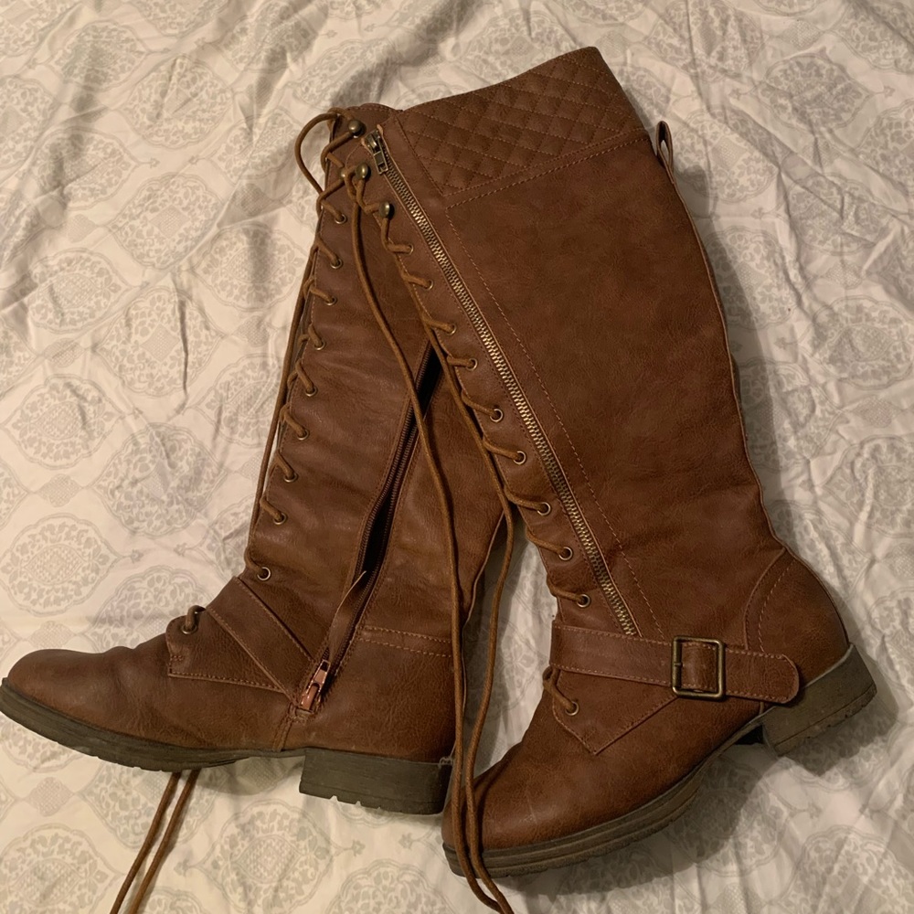 Lace up tall boots. Size 7.5. Brown color